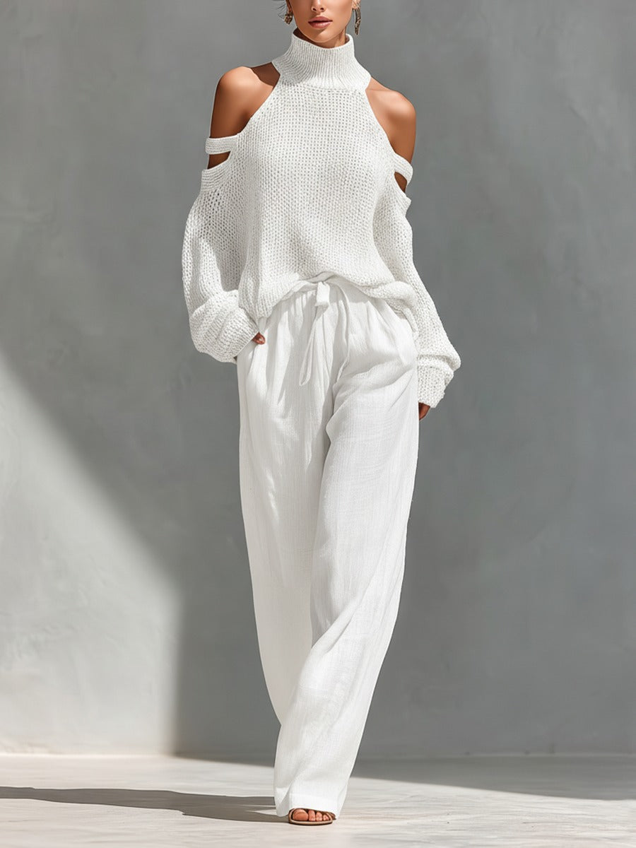 A person models the rosalie | Ensemble Deux Pièces Off-Shoulder against a plain gray background, with natural light casting soft shadows.